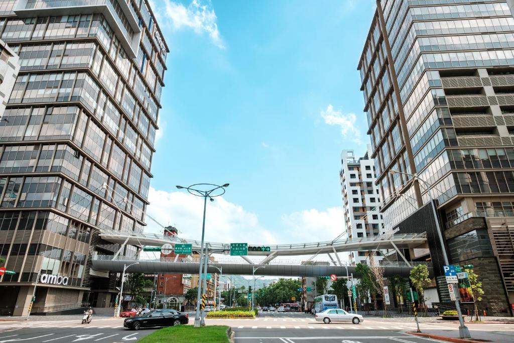 an intersection in a city with tall buildings at amba Taipei Songshan in Taipei