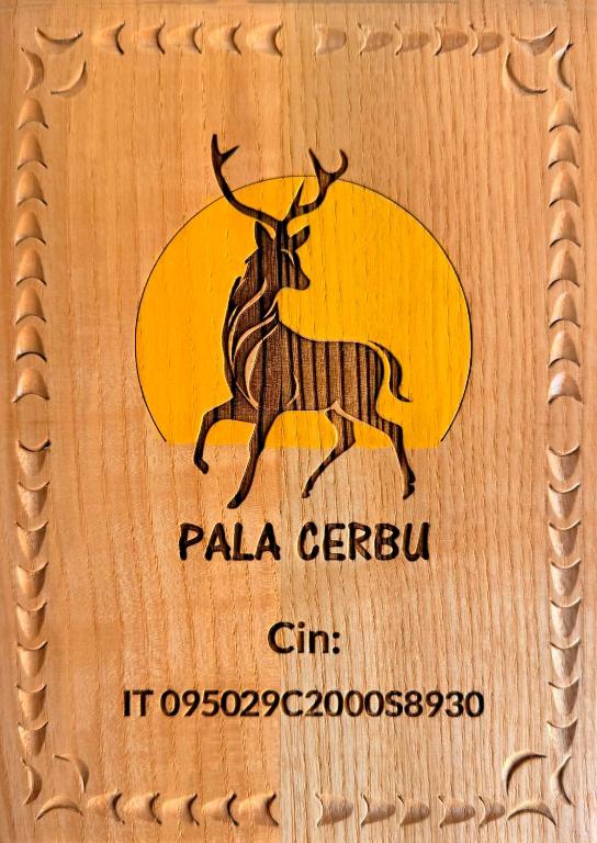 a stamp with a picture of a bull with a surfboard at Pala Cerbu in Mògoro