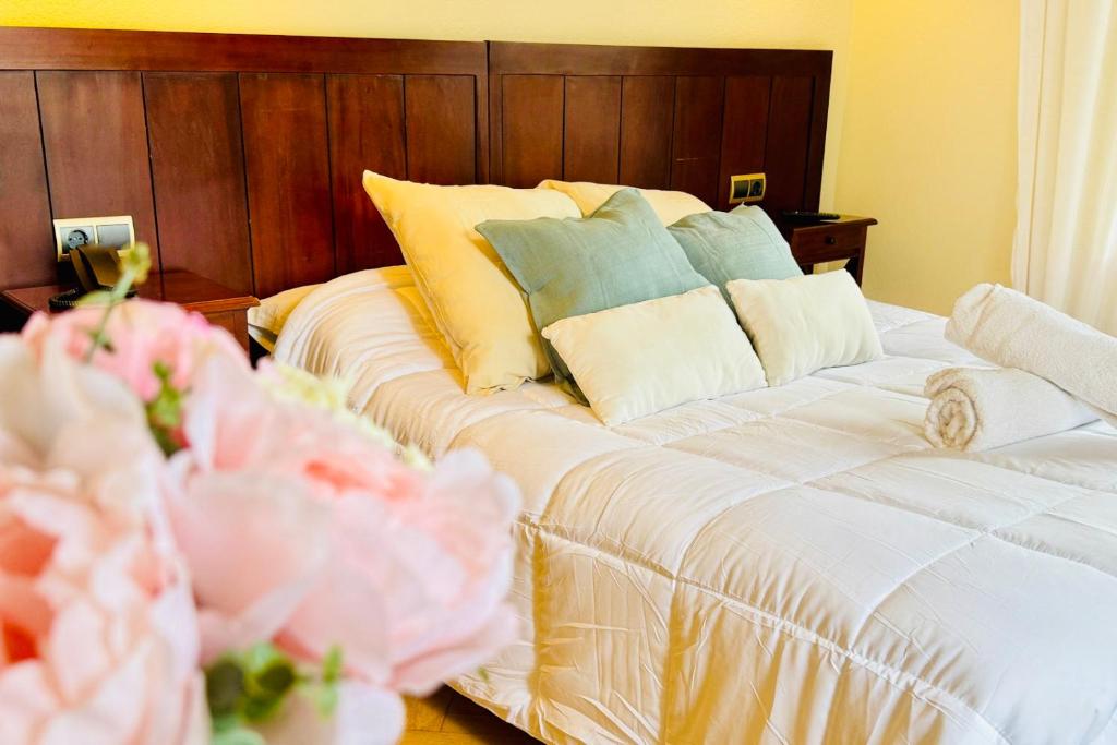 En eller flere senge i et værelse på Punta me Hotel