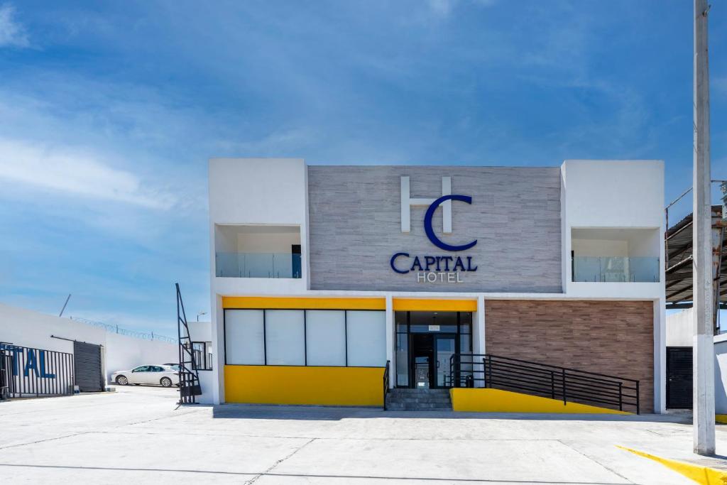 a building with a c capital sign on it at Capital Hotel Saltillo in Saltillo