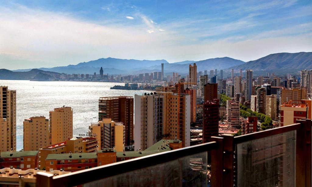 a view of a city with the water and buildings at MuchoSol in Benidorm