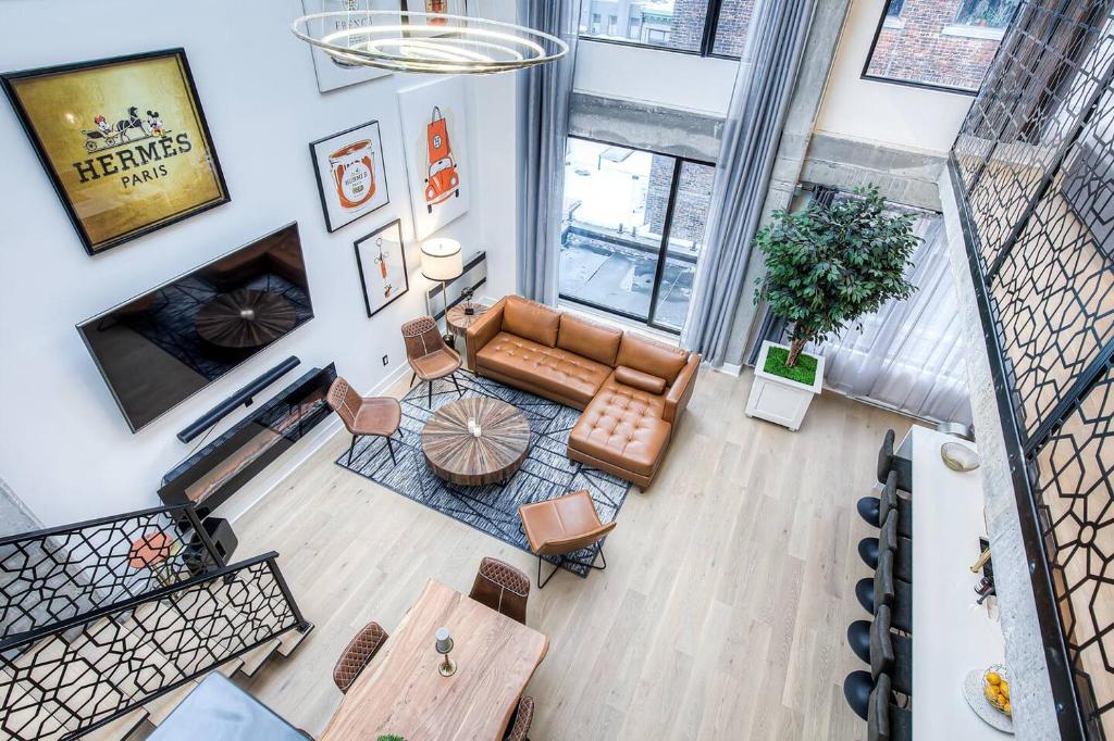 an overhead view of a living room with a couch at Luxury Penthouse, Private Rooftop, Old MTL in Montréal
