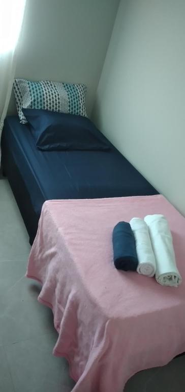 Ένα ή περισσότερα κρεβάτια σε δωμάτιο στο Casa ótima localização com garagem!!!!