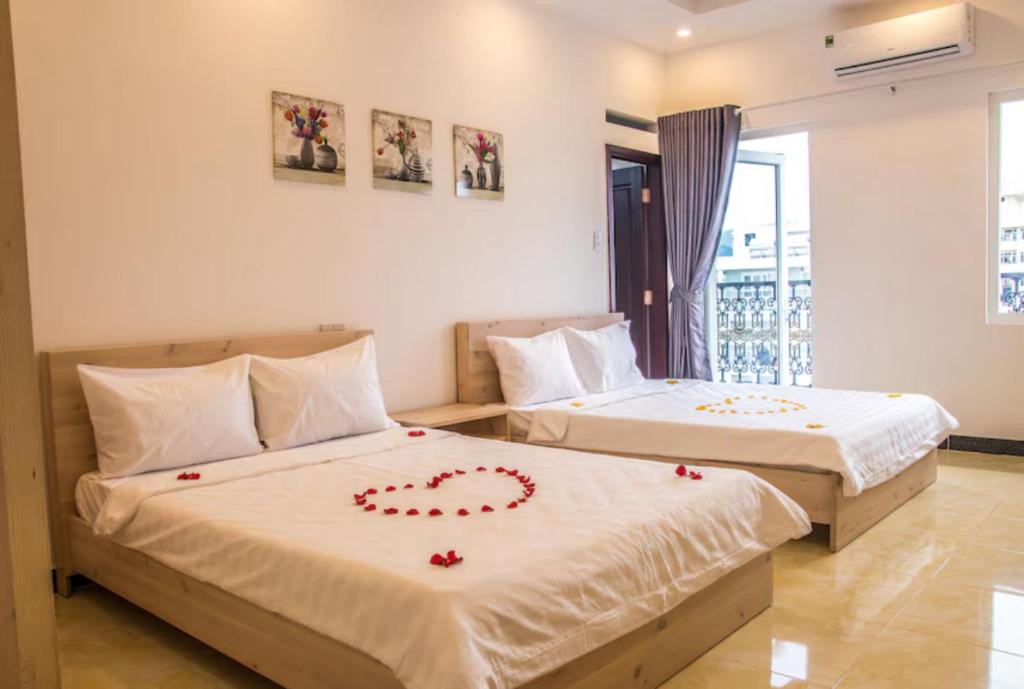 Ένα ή περισσότερα κρεβάτια σε δωμάτιο στο Maika Hotel Nha Trang