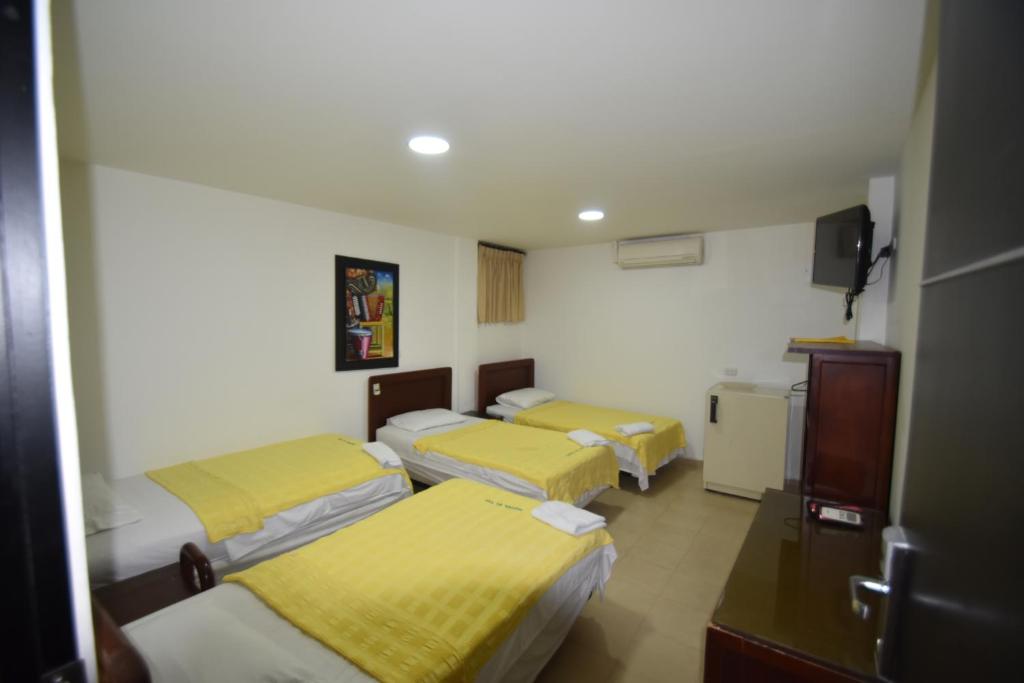 Postel nebo postele na pokoji v ubytování Hotel Nuevo Tio