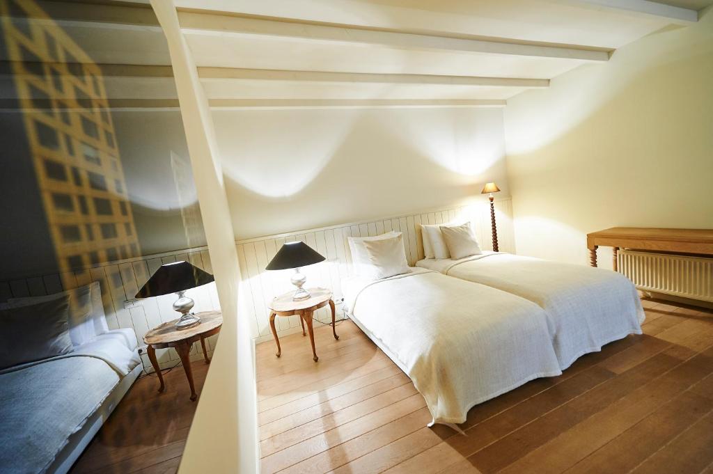 Postel nebo postele na pokoji v ubytování B&B Maryline