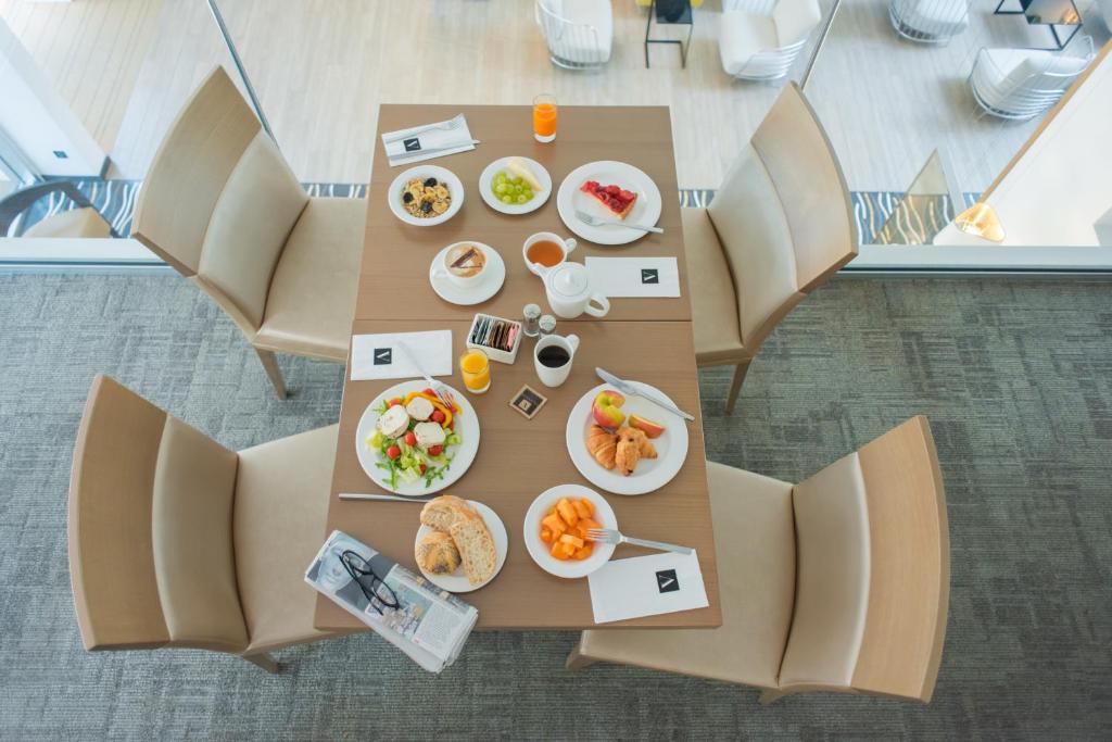 an overhead view of a table with plates of food at Hotel Valentina in St. Julianʼs