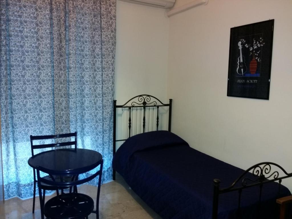 Łóżko lub łóżka w pokoju w obiekcie Aparthotel TURNONE