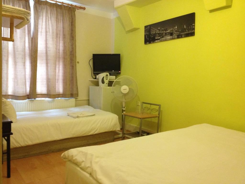 Postel nebo postele na pokoji v ubytování City View Hotel Roman Road