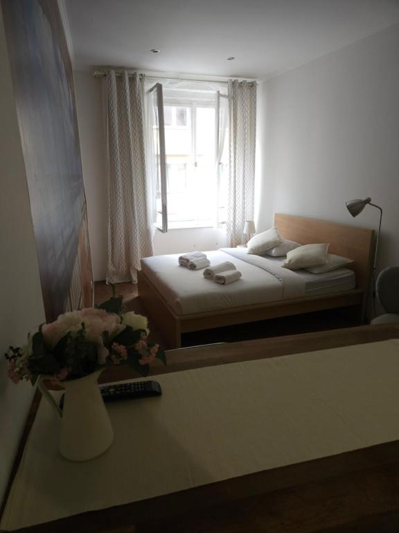 a bedroom with a bed and a window at Apatments Prague by Yuliia in Prague
