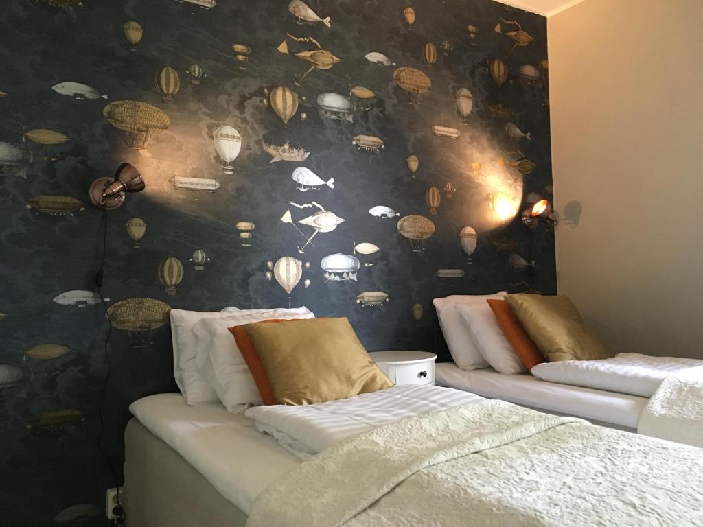 Postel nebo postele na pokoji v ubytování Hotel Wictoria