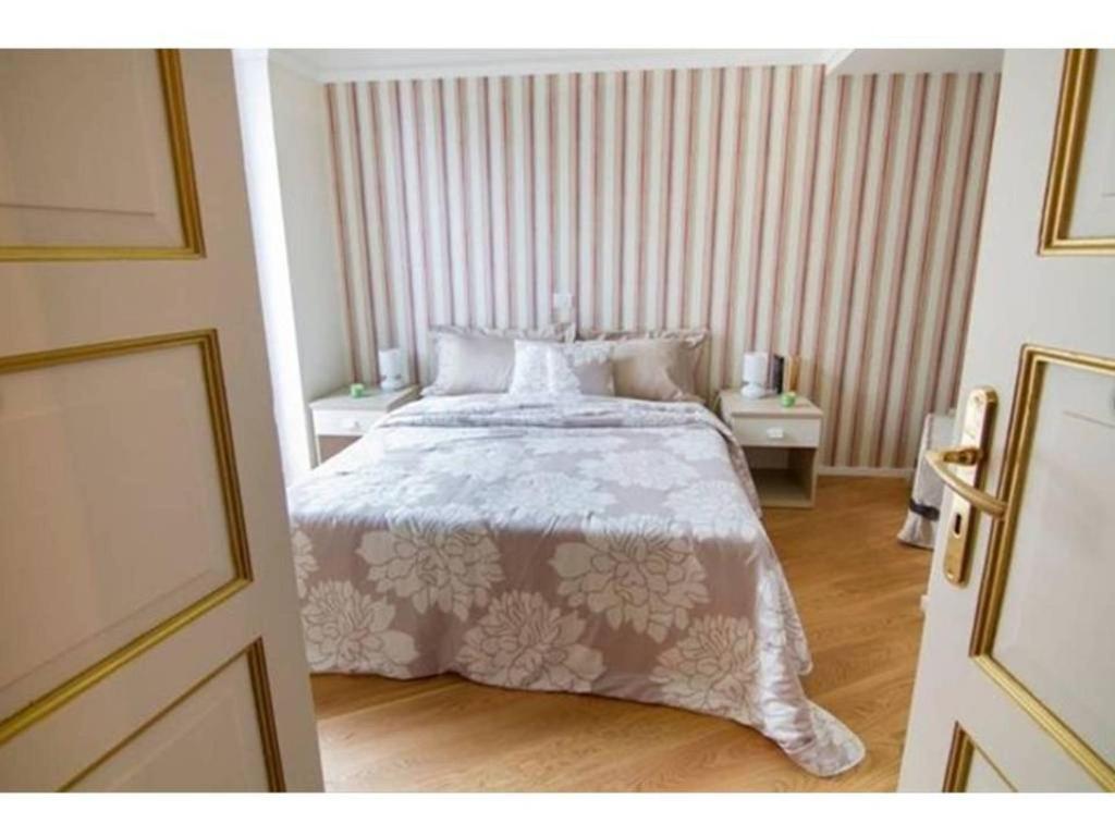 Un pat sau paturi într-o cameră la B&B Fighera