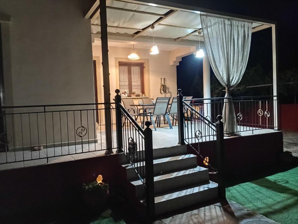 a staircase leading to a house at night at Αρχοντικο in Ayía Sofía