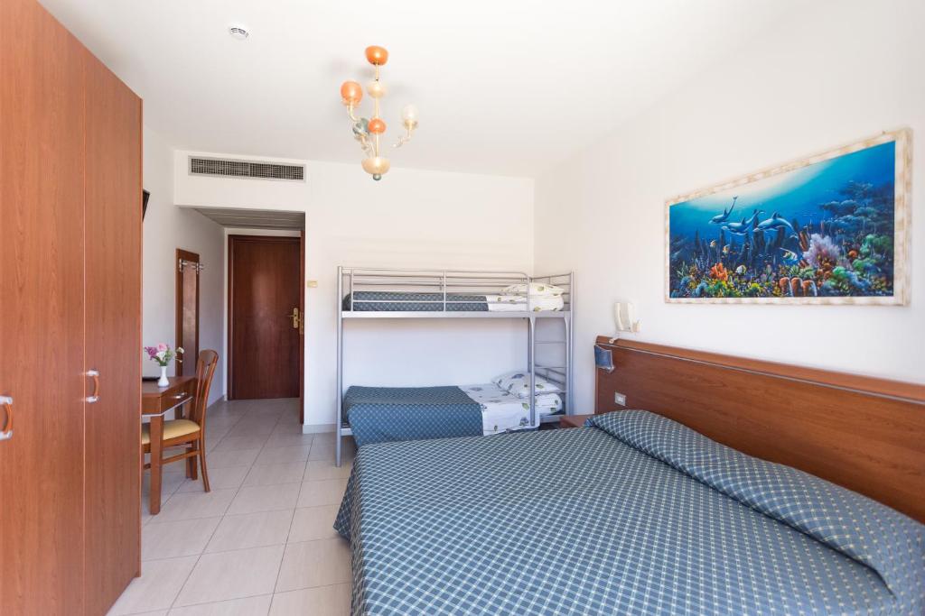 Postel nebo postele na pokoji v ubytování Hotel Abruzzo