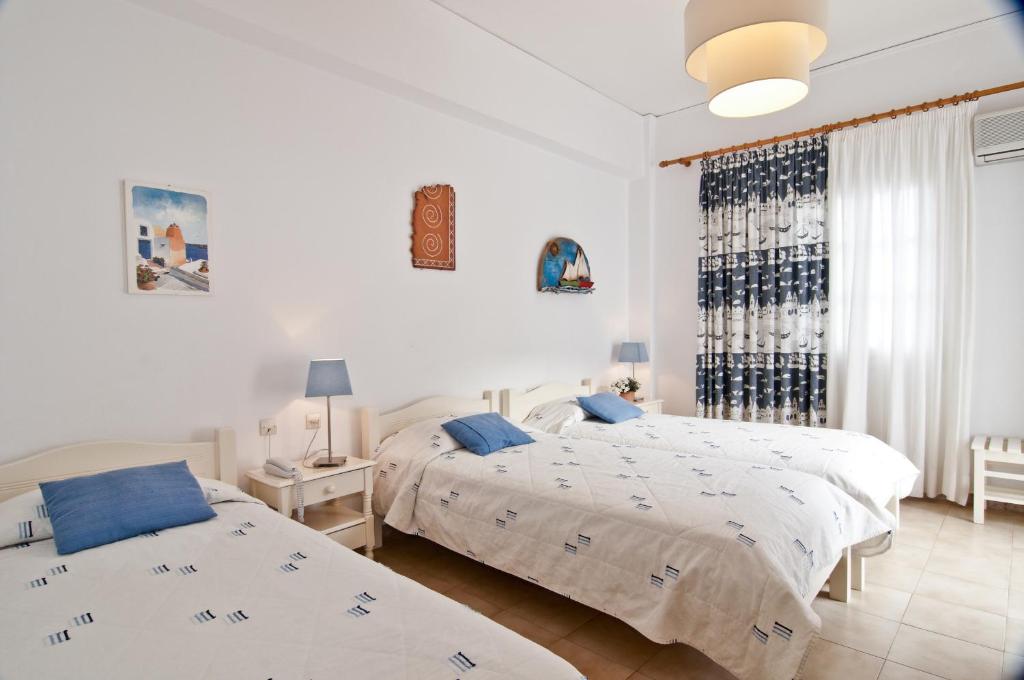 Een bed of bedden in een kamer bij Hotel Matina