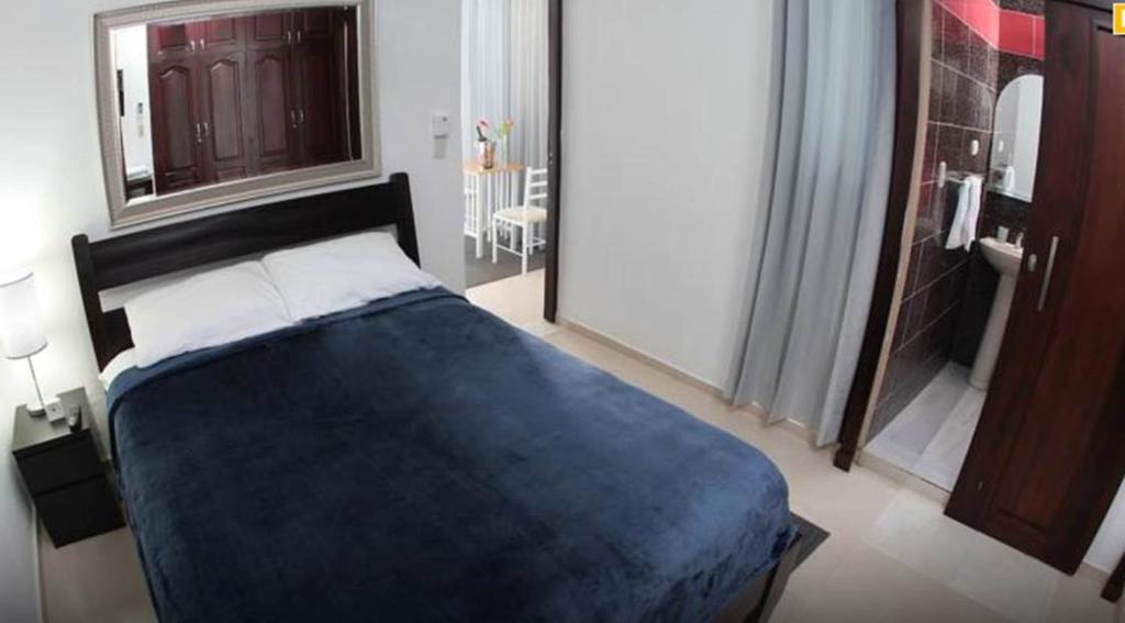Postel nebo postele na pokoji v ubytování Hotel Casa Jum