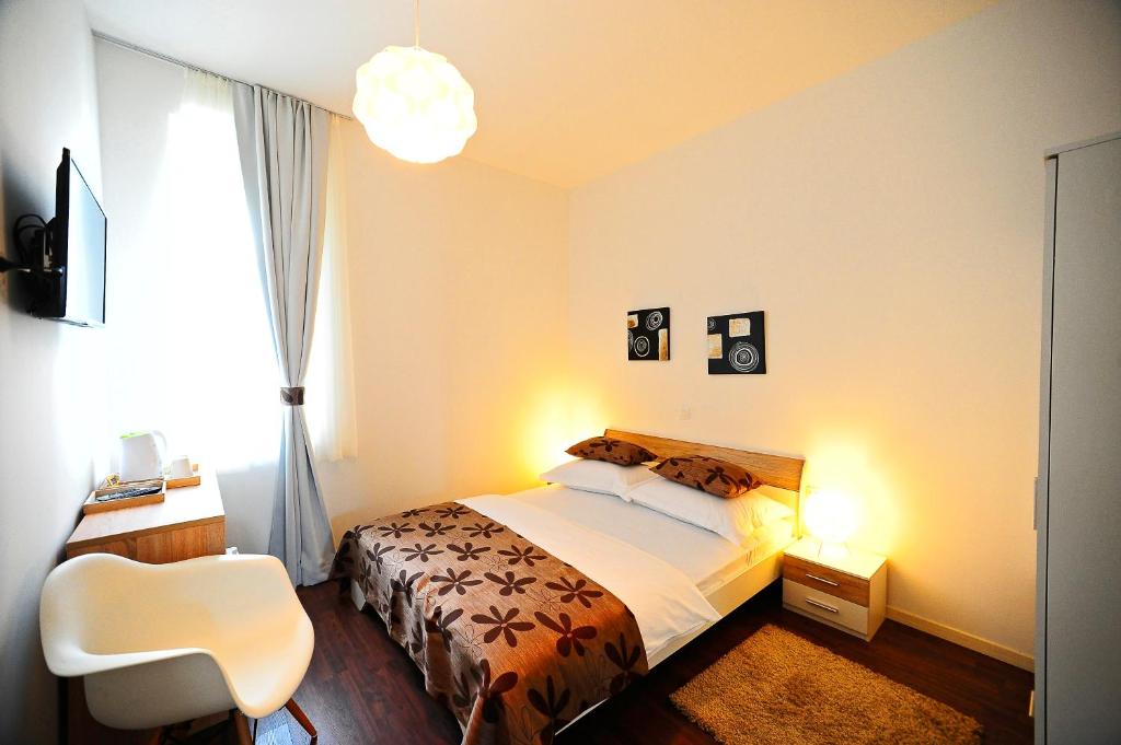 Postel nebo postele na pokoji v ubytování Valenti rooms