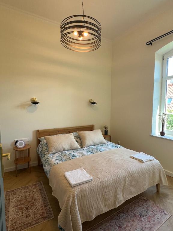 Postel nebo postele na pokoji v ubytování Apartament Frombork Łempicka