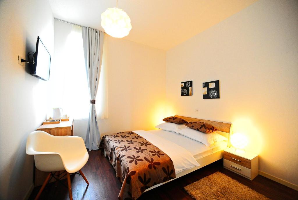Postel nebo postele na pokoji v ubytování Valenti rooms