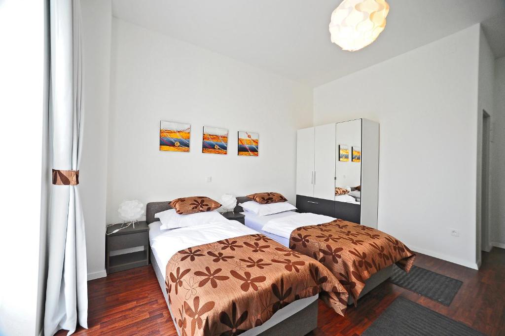 Postel nebo postele na pokoji v ubytování Valenti rooms