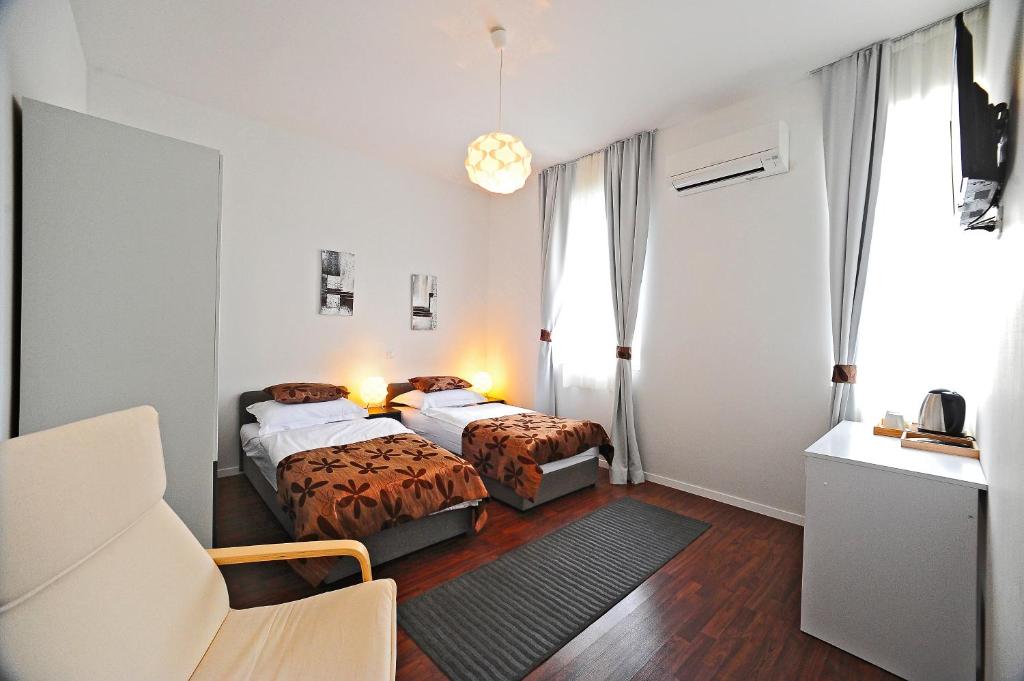 Postel nebo postele na pokoji v ubytování Valenti rooms