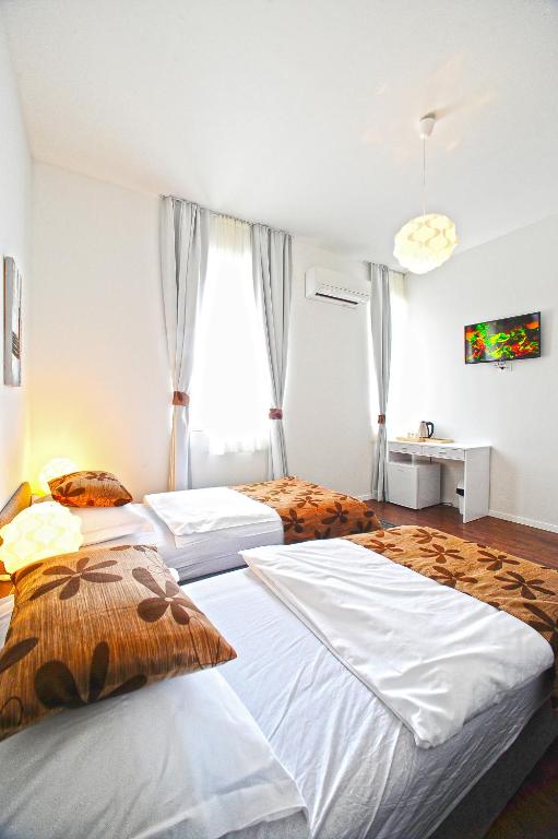 Postel nebo postele na pokoji v ubytování Valenti rooms