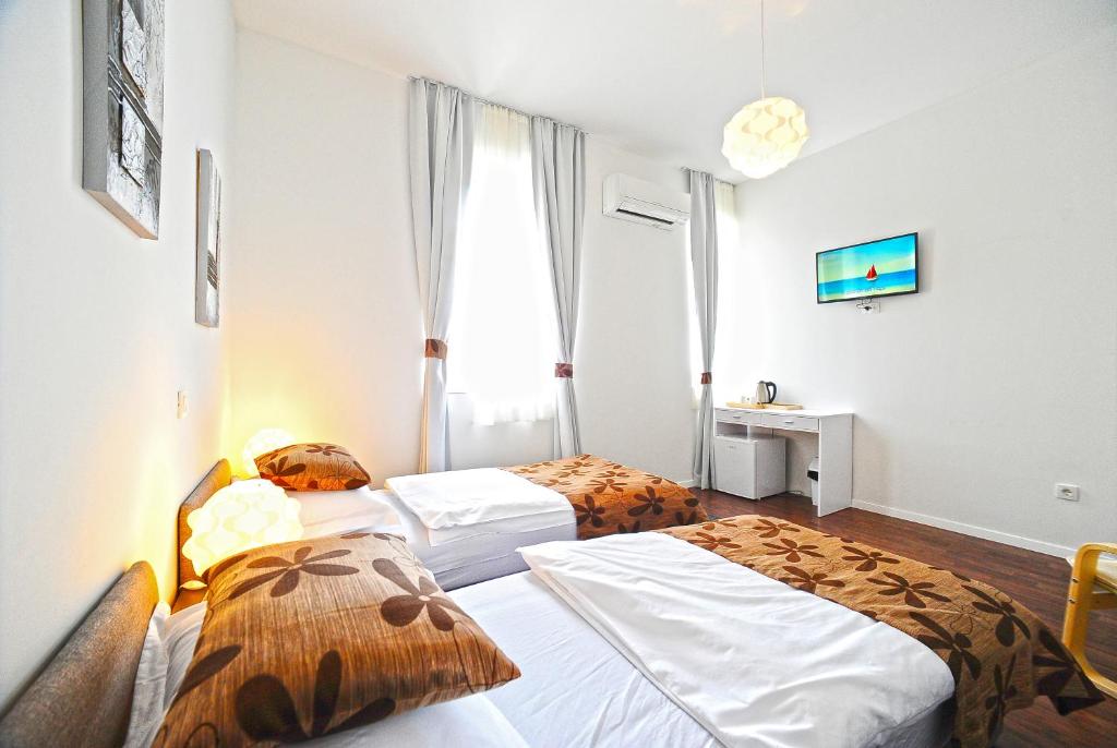 Postel nebo postele na pokoji v ubytování Valenti rooms