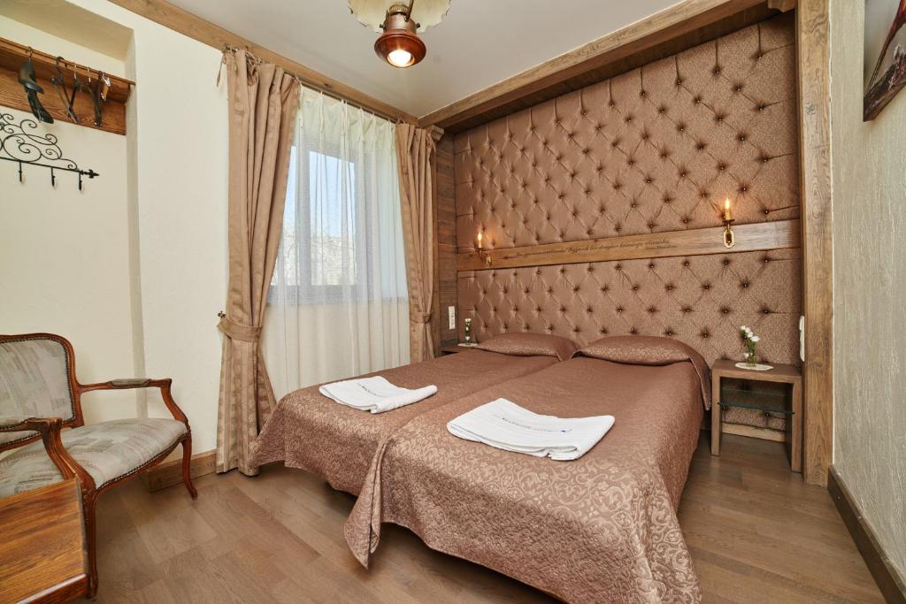 Postel nebo postele na pokoji v ubytování Medžiotojų Sostinė