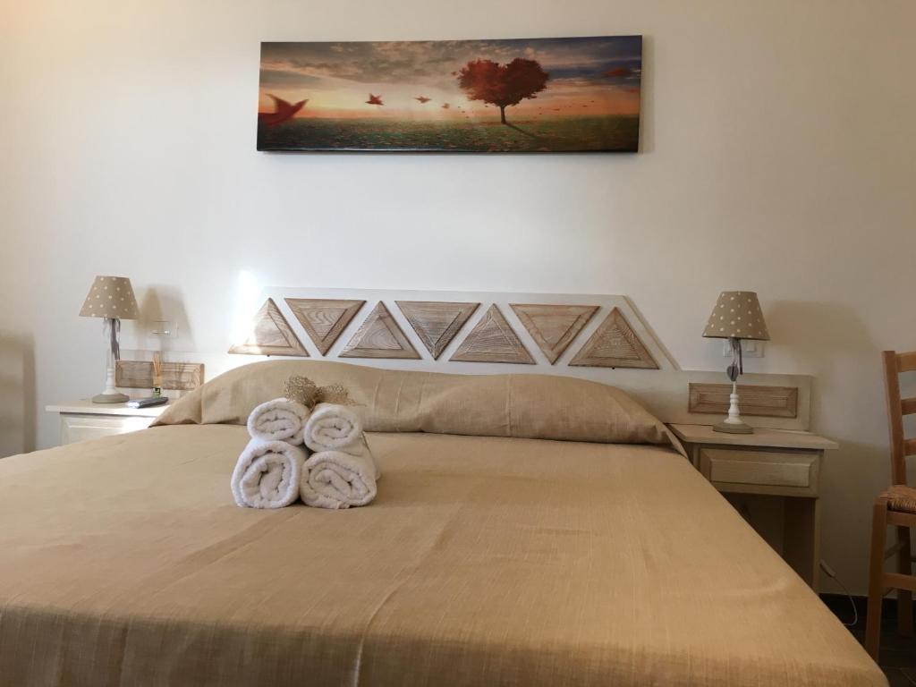 Postel nebo postele na pokoji v ubytování Monti di Jogliu