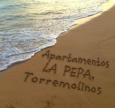 a message written in the sand on the beach at Apartamento Pepa Bajondillo in Torremolinos