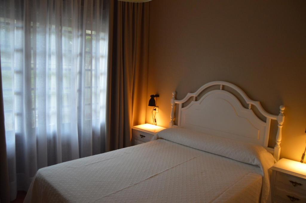 Łóżko lub łóżka w pokoju w obiekcie Hotel Chancelas