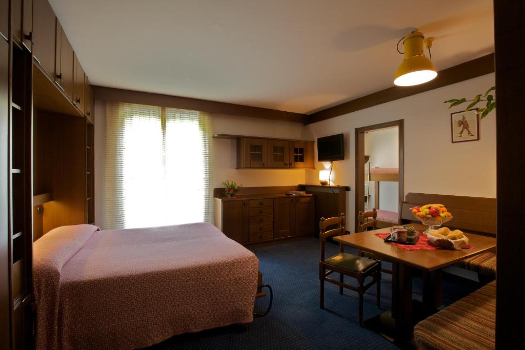 Postel nebo postele na pokoji v ubytování Hotel Carlone