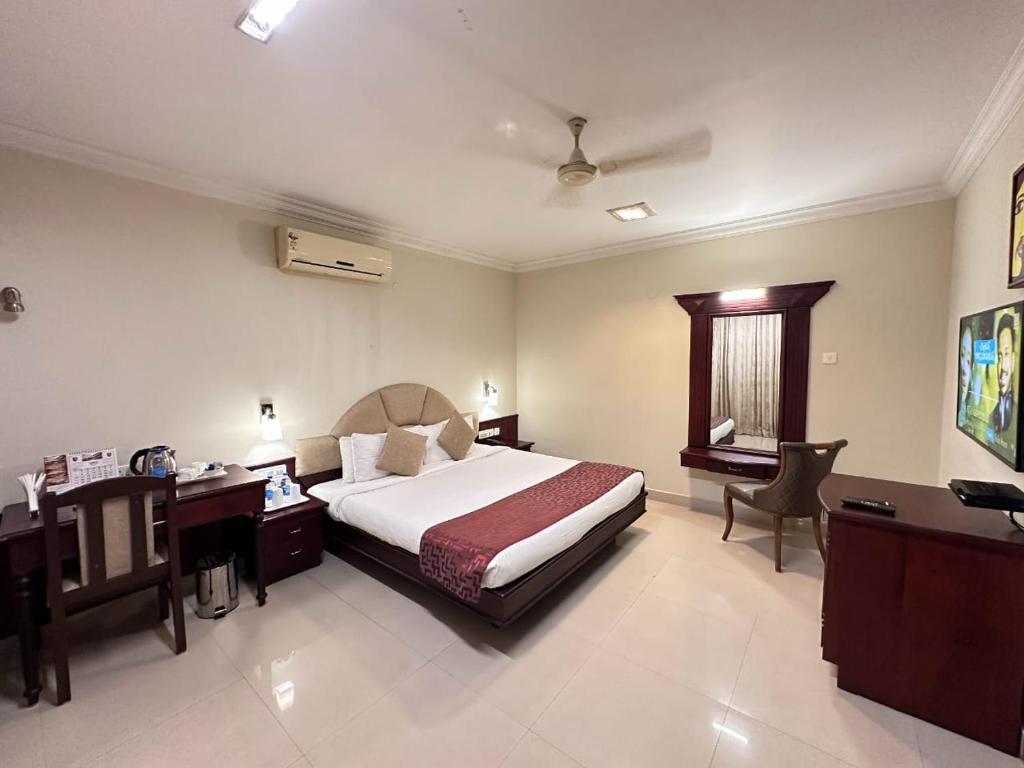 Postel nebo postele na pokoji v ubytování Hotel Sabari Park