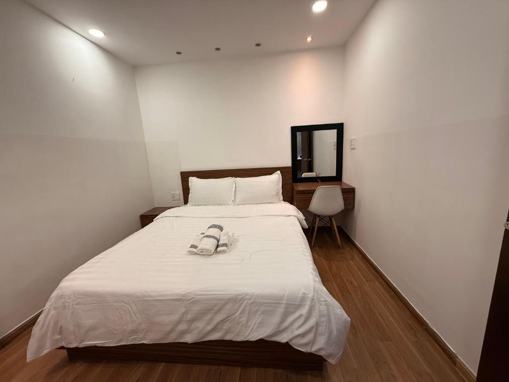 Ένα ή περισσότερα κρεβάτια σε δωμάτιο στο Tran Nguyen Condotel Dalat Center