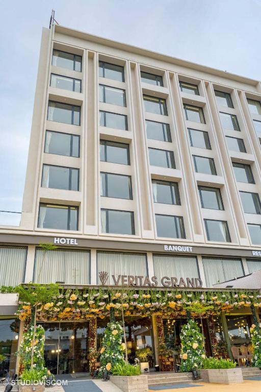a hotel front view of a building at Hotel Veritas Grand in Sānand