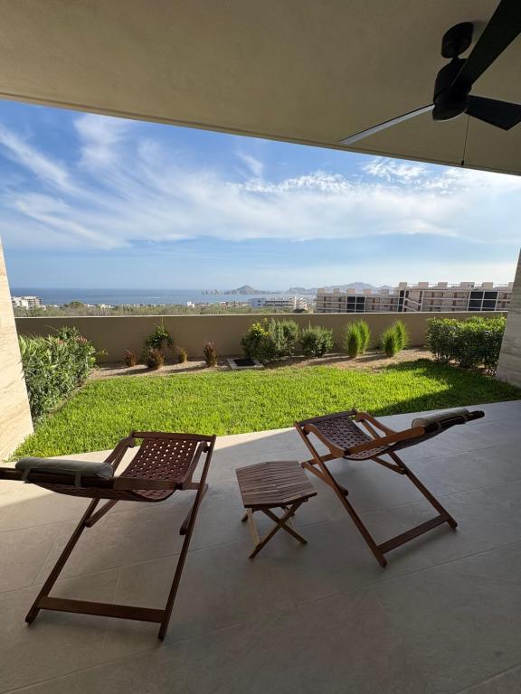 two chairs and a table on a patio at Family-Friendly Oceanview Retreat Resort Access in Cabo San Lucas