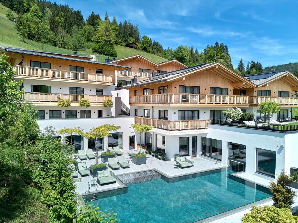 an aerial view of a hotel with a swimming pool at Mount Med Resort in Oberau