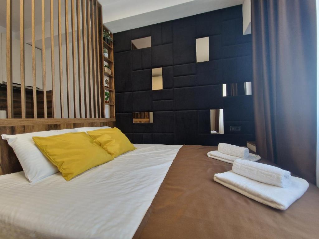Ένα ή περισσότερα κρεβάτια σε δωμάτιο στο Mamaia Studio