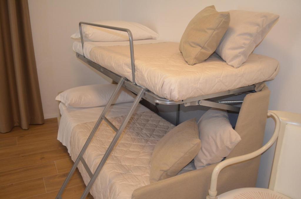 Postel nebo postele na pokoji v ubytování Hotel RivaMia