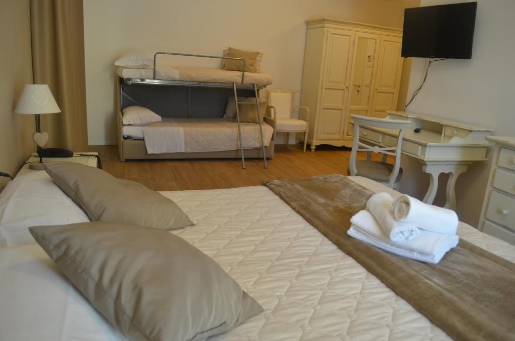 Postel nebo postele na pokoji v ubytování Hotel RivaMia