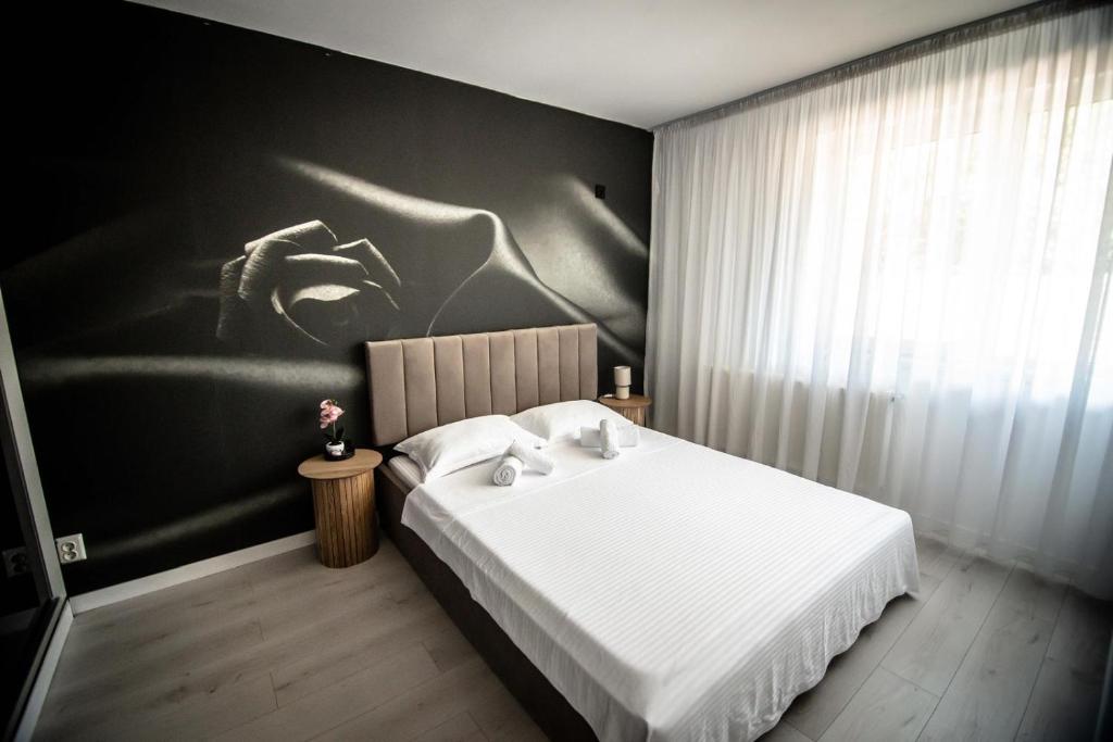 Postel nebo postele na pokoji v ubytování Orchid Apartment
