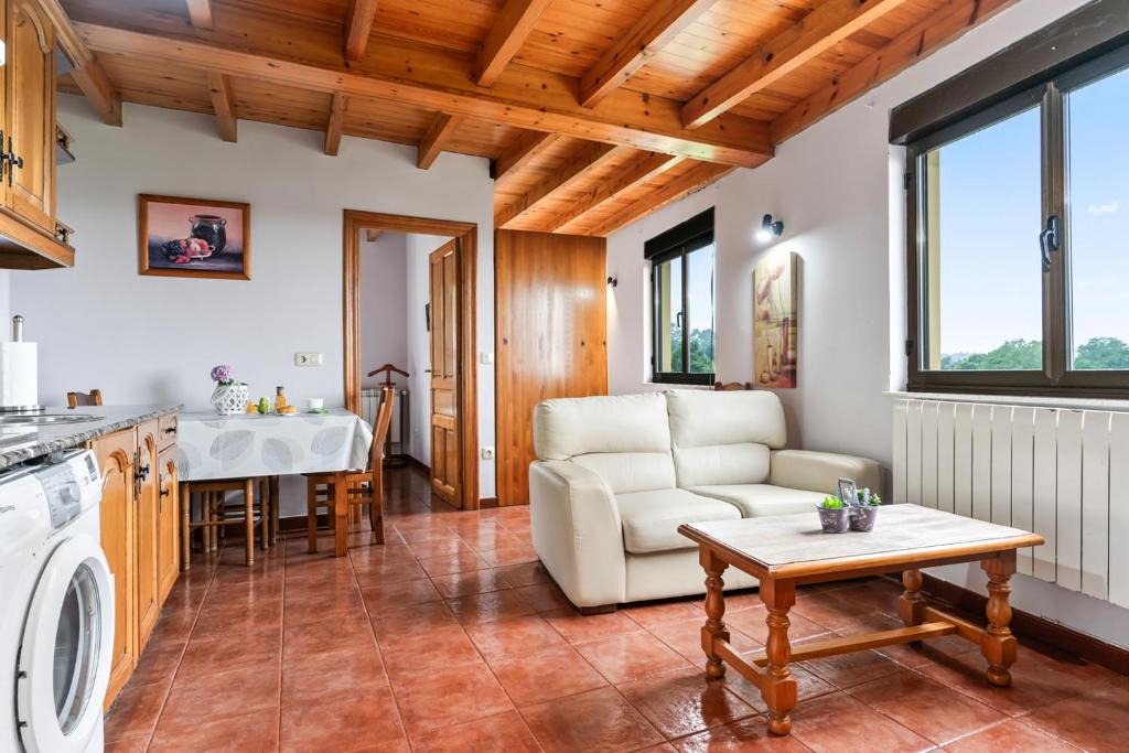 a living room with a couch and a table at Romano I megustarural in Porrúa