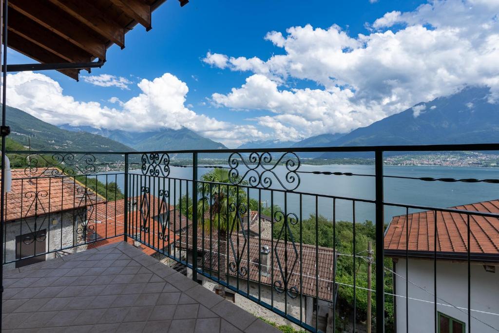 a balcony with a view of a body of water at Casa Gigi in Vercana