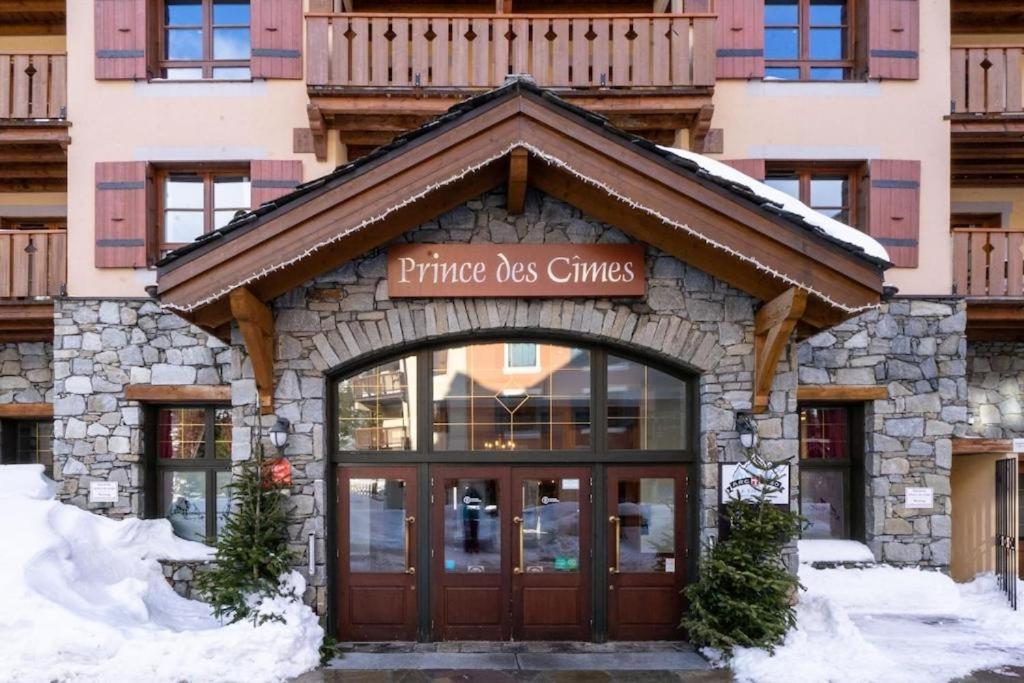 a entrance to a pine kiss chinese restaurant in the snow at Cozy studio 3 guests, private terrace, inside pool, spa, luxurious residence, ski-in ski-out in Bourg-Saint-Maurice