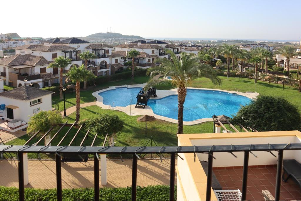 a view of a swimming pool from a balcony at Luminoso Terrazas Piscinas Parking in Vera