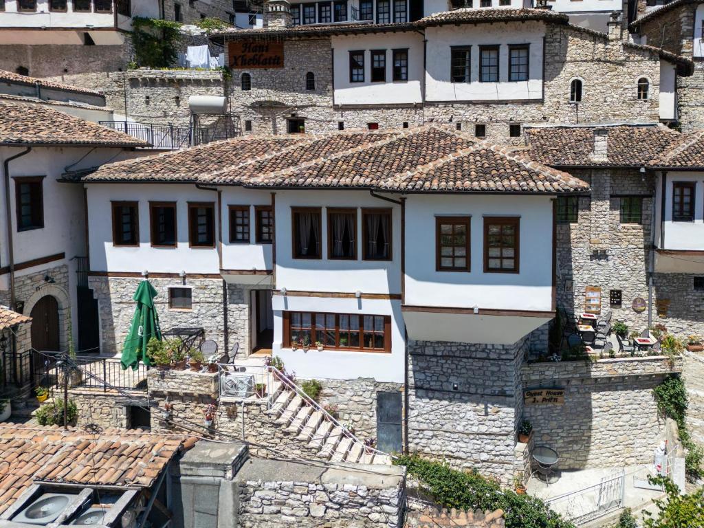 a group of stone houses in a city at Guest House J.Prifti in Berat