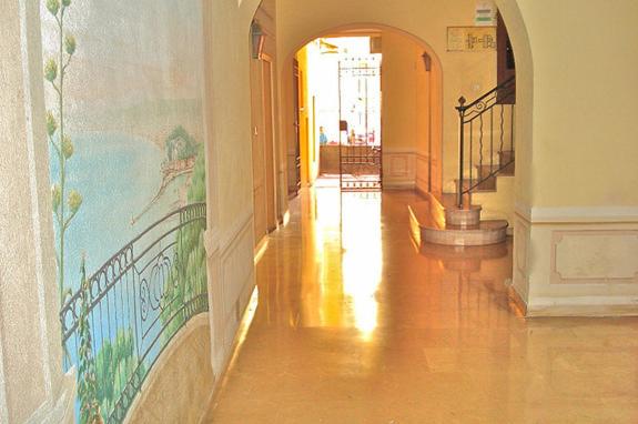 a hallway with a painting on the wall of a building at Rossetti in Nice