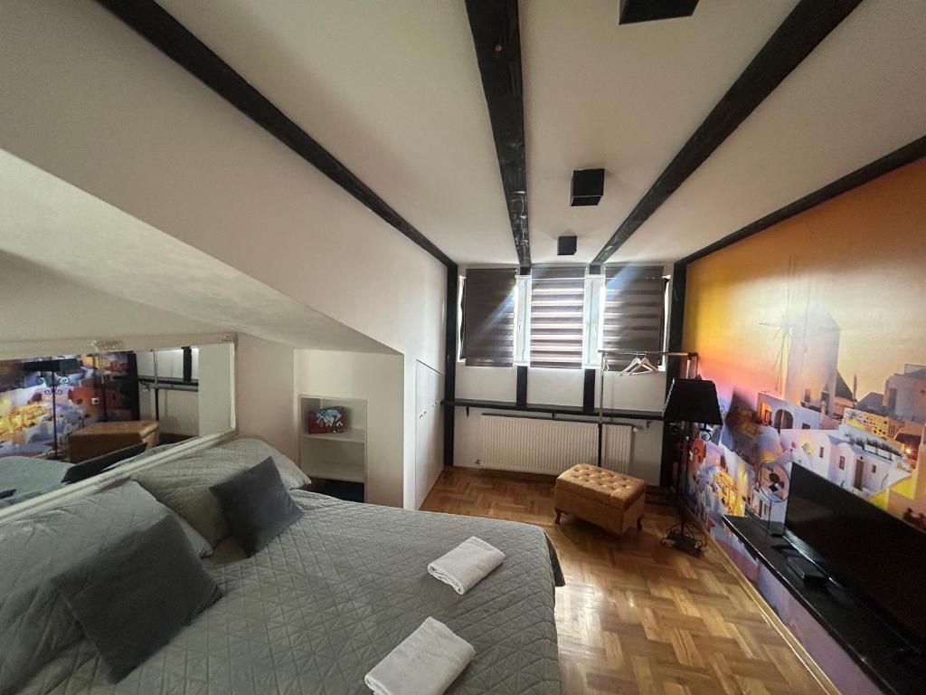 TV a/nebo společenská místnost v ubytování MM Apartman