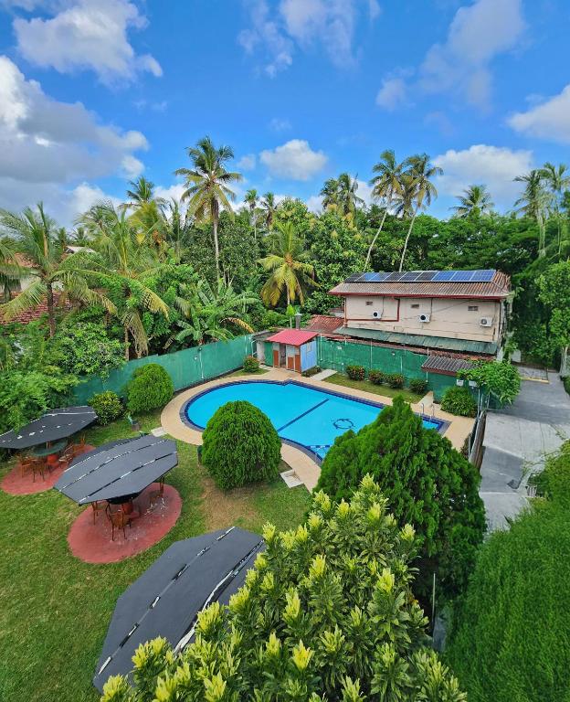 an aerial view of a resort with a swimming pool at Airport Green View Hotel Katunayake in Andiambalama