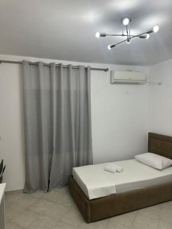 Ένα ή περισσότερα κρεβάτια σε δωμάτιο στο Gold Rooms I